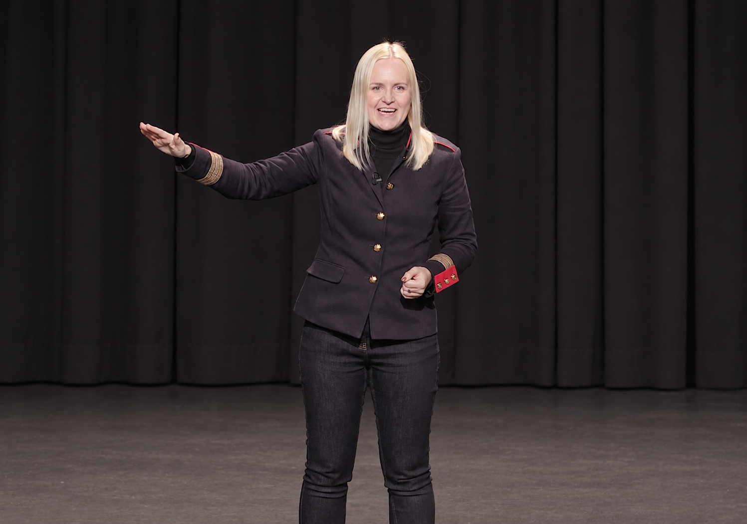 Loretta Milan speaking on stage
